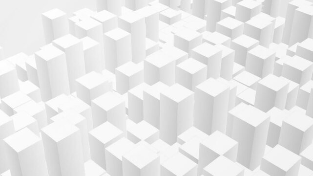 White geometric blocks rise at varied heights to form an abstract modern architectural pattern.