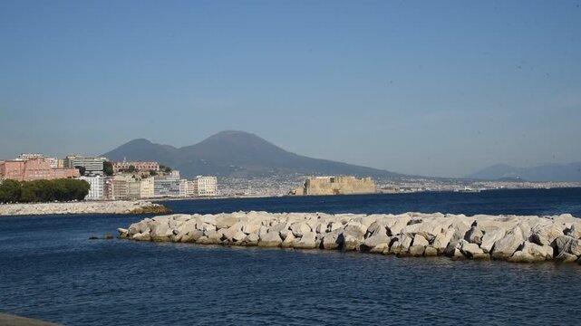 Scenic view of mount vesuvius and castel dell'ovo in naples, italy
