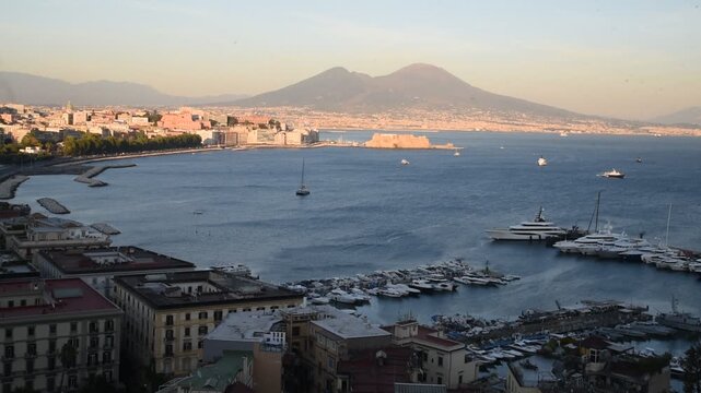 Naples cityscape with mount vesuvius at sunset