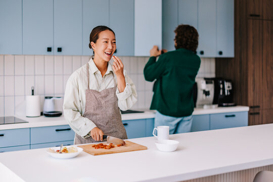 Happy Couple Cooking Together in Modern Home Kitchen During Casual Weekend Morning
