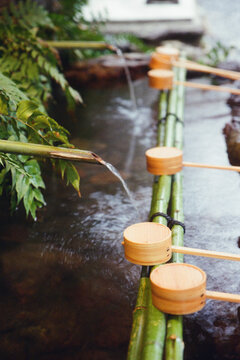 Bamboo ladles at a Japanese water purification basin.