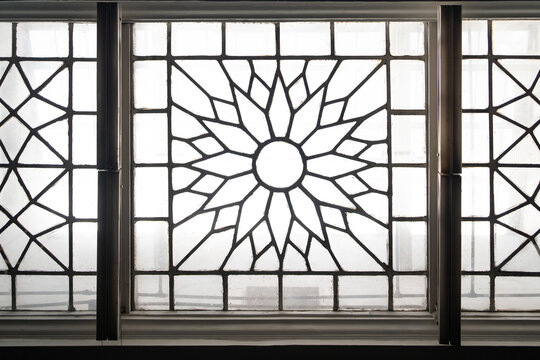 Historic stained glass skylight with geometric floral pattern