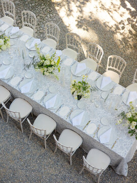 Aerial of beautiful flowers, candles and cutlery on decorated table