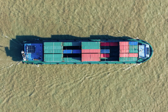 container cargo ship sailing on river