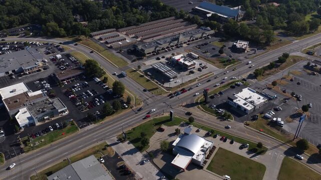 Aerial of commercial and industrial development in Springfield Missouri featuring multiple large parking lots and various retail and warehouse buildings