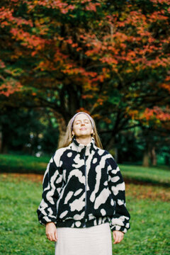 Woman in nature with vibrant autumn colors