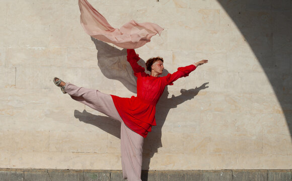 A woman in the red in the beige space