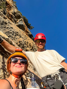 Climbers Take a Break During Rock Climbing at a Sunny Location