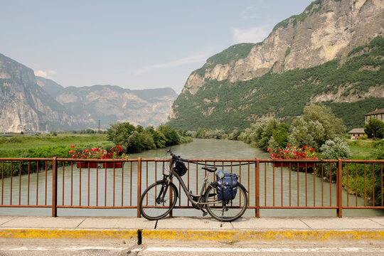 Touring bike on bridge over Adige River, South Tyrol