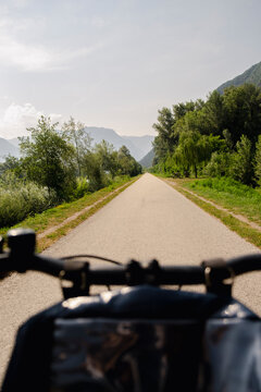 pov Cyclist view on quiet bike path during summer trip in Italy