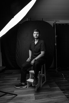 Professional subject posing in black and white studio