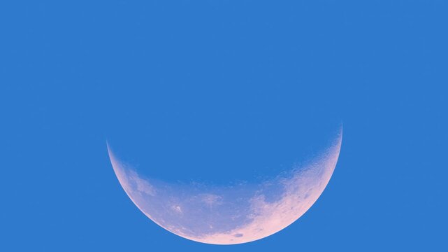 Beautiful pink moon phases over blue sky 3d animations, showcasing various rotations