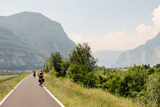 Cyclists riding toward mountains during bikepacking trip