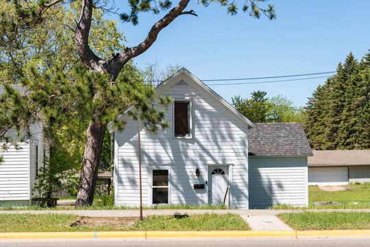 White Clapboard House on Quiet Street