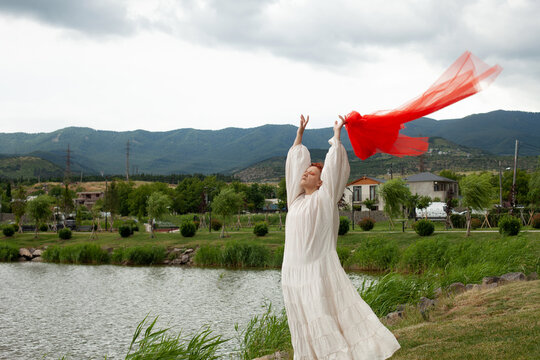 Dance in white dress with the red tulle