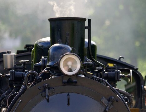front of a steam engine 