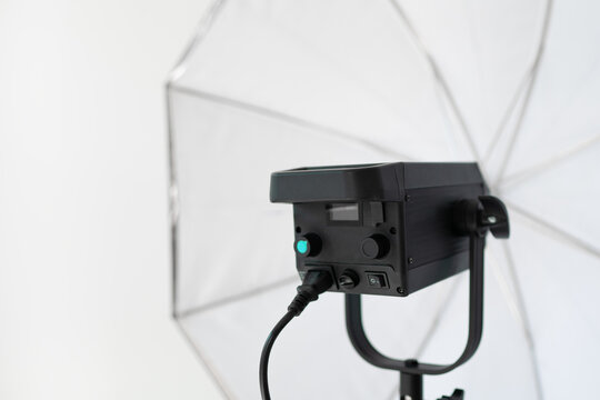 Professional photography studio light with power controls and softbox reflector - umbrella