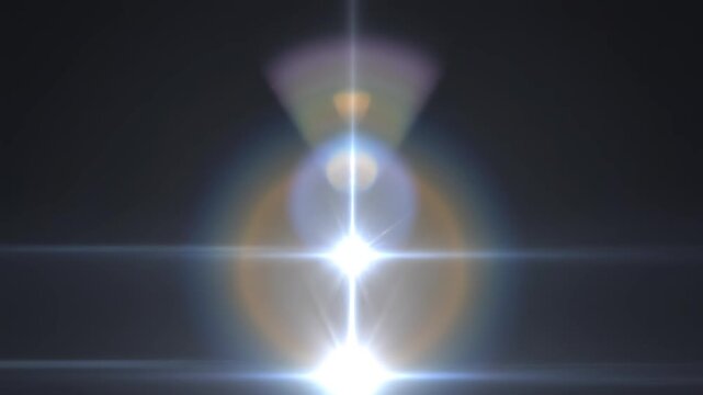 Lens flare effect growing in intensity with cinematic light streaks and bokeh during a subtle zoom out