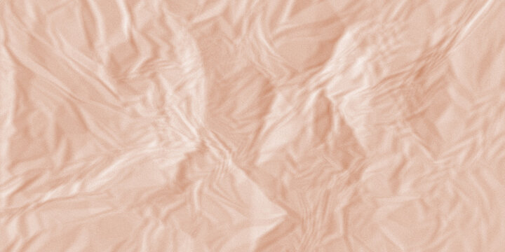 Crumpled peach paper texture background with organic wrinkled creases for craft branding.