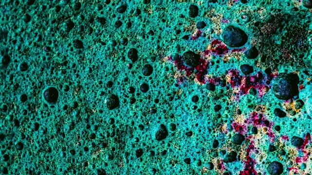 Abstract green textured surface with pores