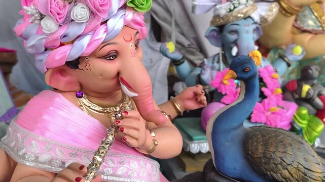 06 September 2026, Newly made idols of the God known as Ganesha or Ganapati for sale at a shop on the eve of Ganesh festival in Pune, India.