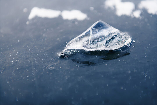 Beautiful ice on the frozen lake in winter. Macro image. Abstract winter nature background.