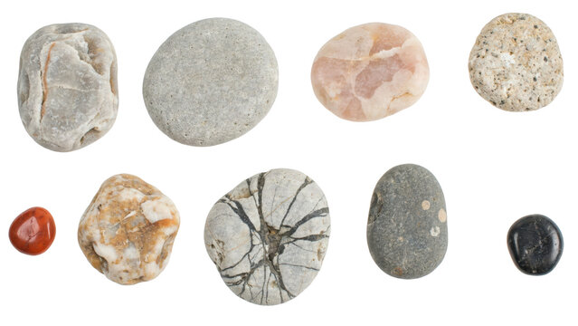 Collection of various natural river stones and pebbles with different textures and colors arranged on white isolated on a transparent background