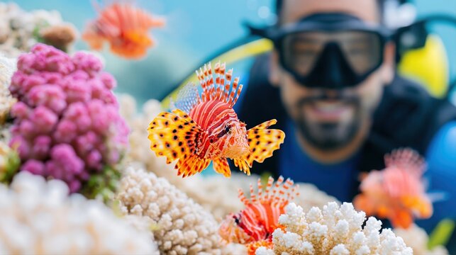 Lionfish swimming in tropical ocean coral reef underwater with diver