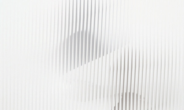 Abstract pattern of vertical lines with overlapping shadows, creating a sense of depth and layered structure