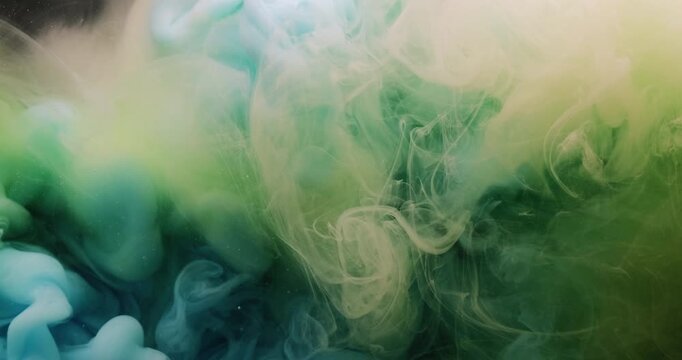 Paint mix. Fume drop explosion. Blur blue yellow color water dye liquid particles acrylic cloud texture spreading on abstract art background.