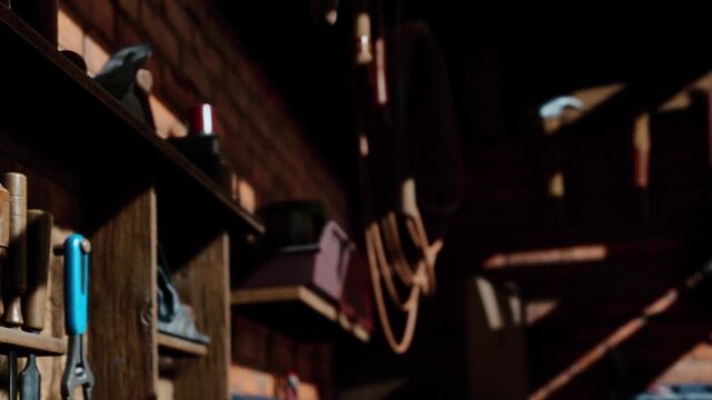 In a warm workshop filled with tools, soft shadows spill across wooden walls as sunlight filters through the window. The atmosphere feels inviting and creative, perfect for craftsmanship.