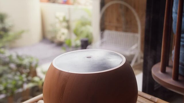 Wood Grain Aroma Diffuser Releasing Steam by a Window