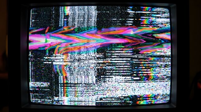 Grainy VHS tape glitch burn with tracking noise and neon color fringing