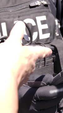 Crime and police on the streets suspect handcuffed close up