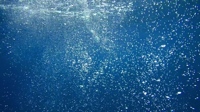 Bubbles under the sea in the crystal clear green sea water. Mediterranean bubbles. Real image very suitable for backgrounds, Rising Bubbles in Deep Underwater, Under with bubble. Great for background.