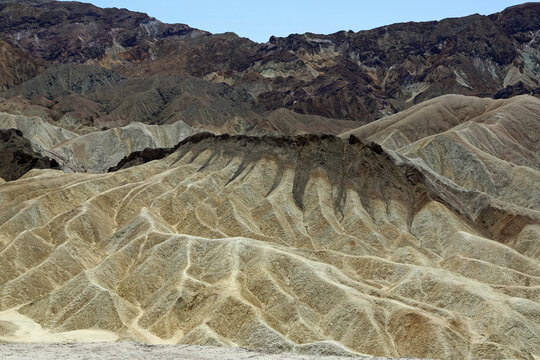 The dark capping mountain - Zabriskie Point, Death Valley National Park, California