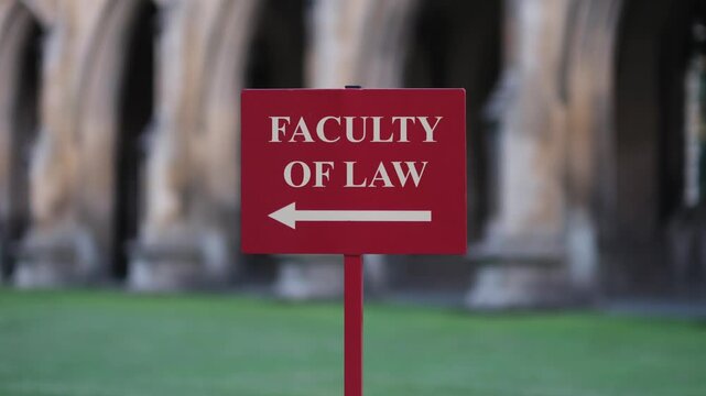 Push-In On A Faculty Of Law Sign On Prestigious English University Lawn