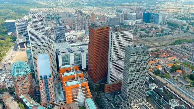 The Hague, Netherlands. Business center of The Hague. Large train station Den Haag Centraal. Cloudy weather. Summer day. Drone footage, Point of interest