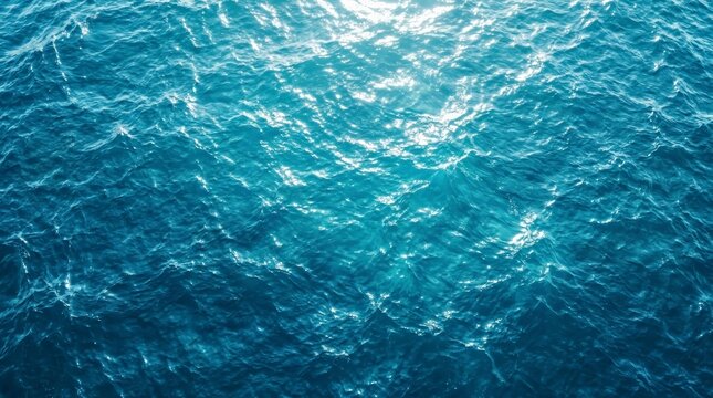 Ocean water surface with ripples and light reflections in blue.