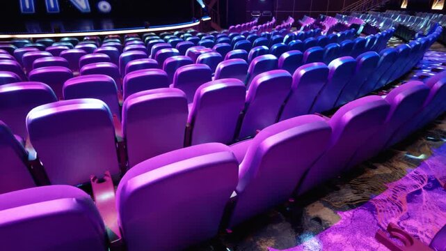 Empty Cruise Ship Theater Auditorum Purple Seats and Colorful Carpet