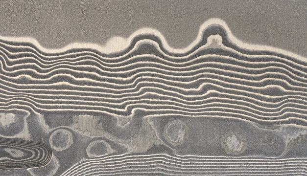 Macro surface of the Damascus steel blade with a unique wavy pattern