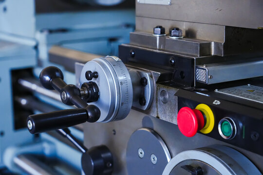 Metal lathe machine with tool holder.