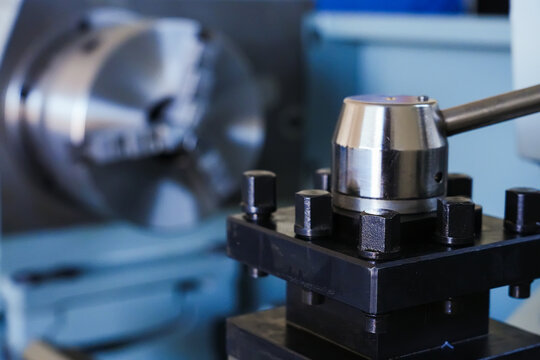 Metal lathe machine with tool holder.