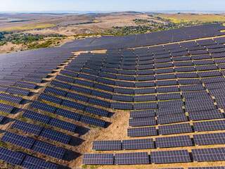 Fototapeta premium Solar panel installation in a rural area generates renewable energy