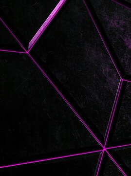 Close-up of a black background with a geometric pattern. the pattern is made up of multiple intersecting lines that form a diamond shape.