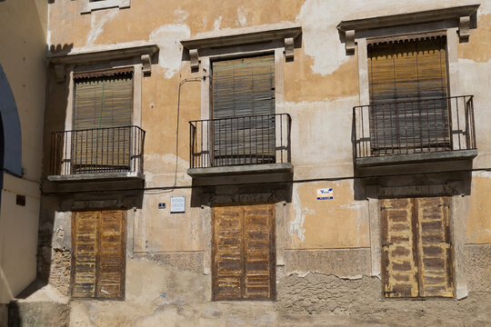 Old building with closed shutters in Borja, Zaragoza, Aragon, Spain during the day