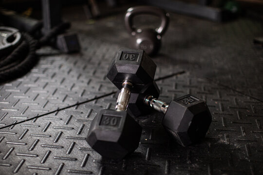 two dumbbells in a gym