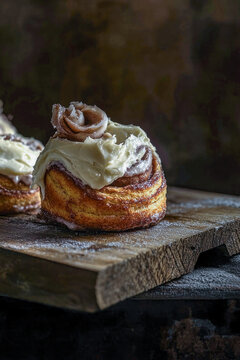 Fresh pastry sliced with a sharp knife on a clean cutting board, ideal for baking or cooking scenes. vertical frame