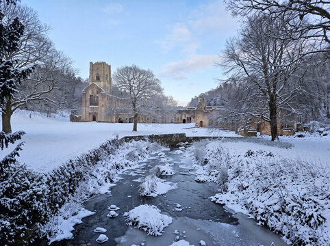 Winter in Fountains Abbey, a ruined Cistercian monastery near Ripon in North Yorkshire, England. Together with the surrounding Studley Royal Park it is a world heritage site