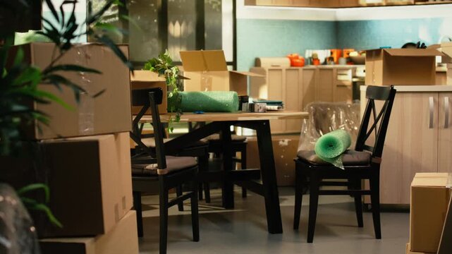 Empty house interior with packed items and cardboard boxes ready for storage and home organization, showing residential relocation preparation and unpacking after moving into a new home.